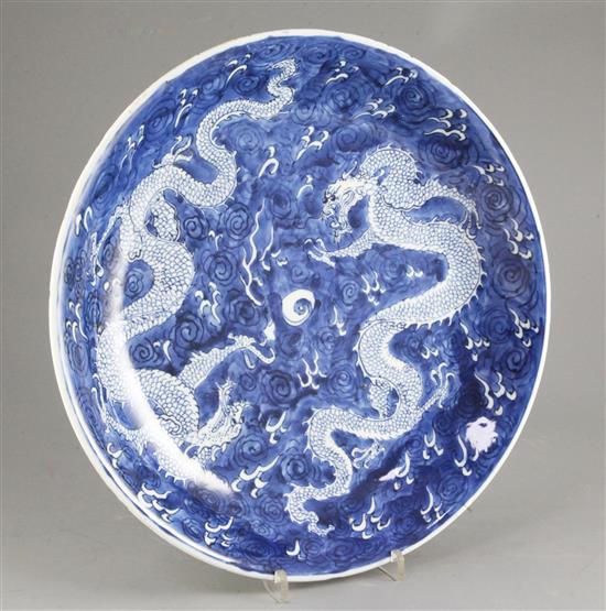 A Chinese blue and white dragon dish, Kangxi period, 34.5cm